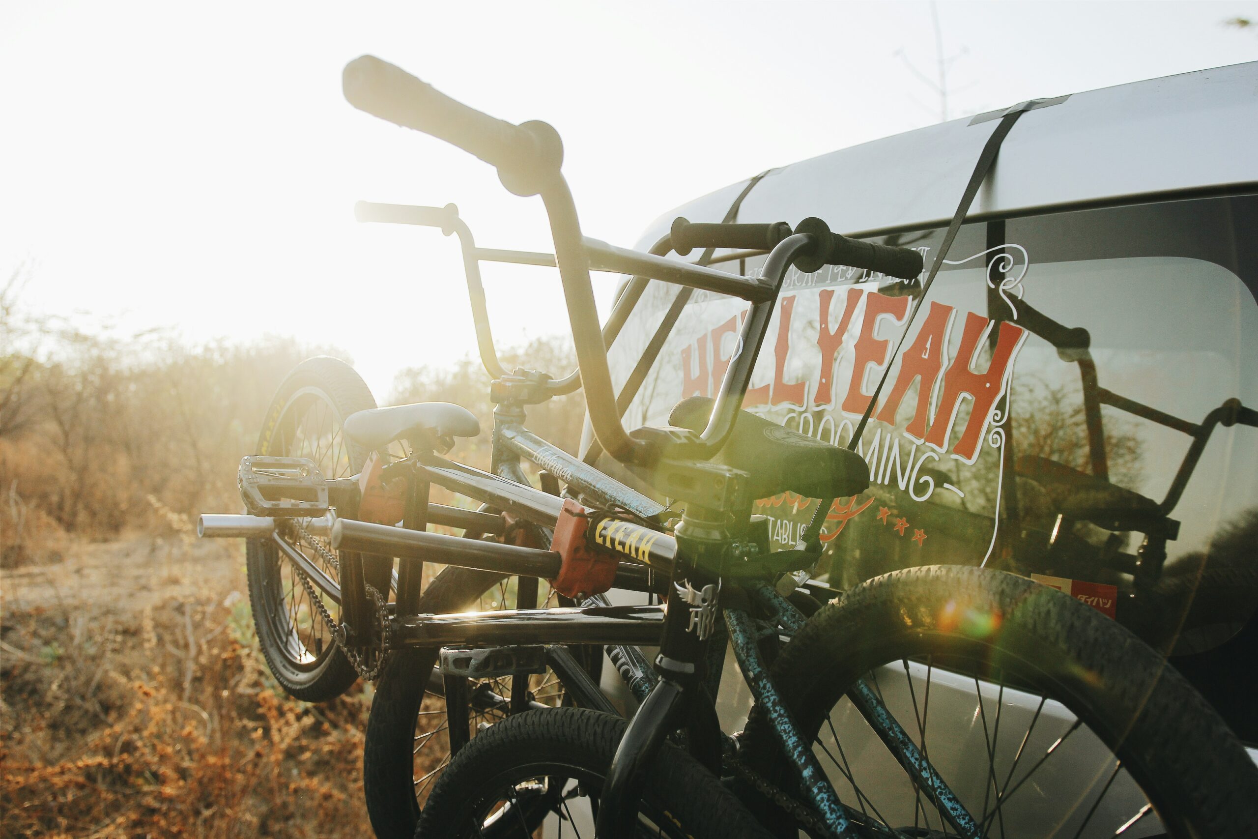 photograph of BMX bikes tied on SUV